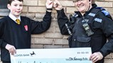 Students unveil mural at local police station