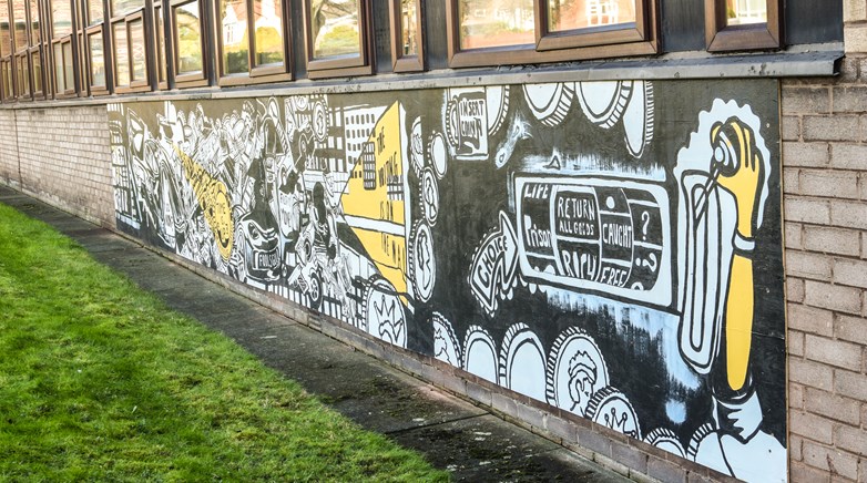 Students unveil mural at local police station