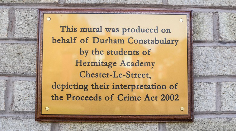 Students unveil mural at local police station