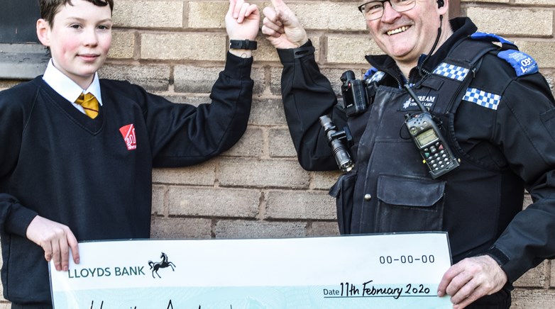Students unveil mural at local police station